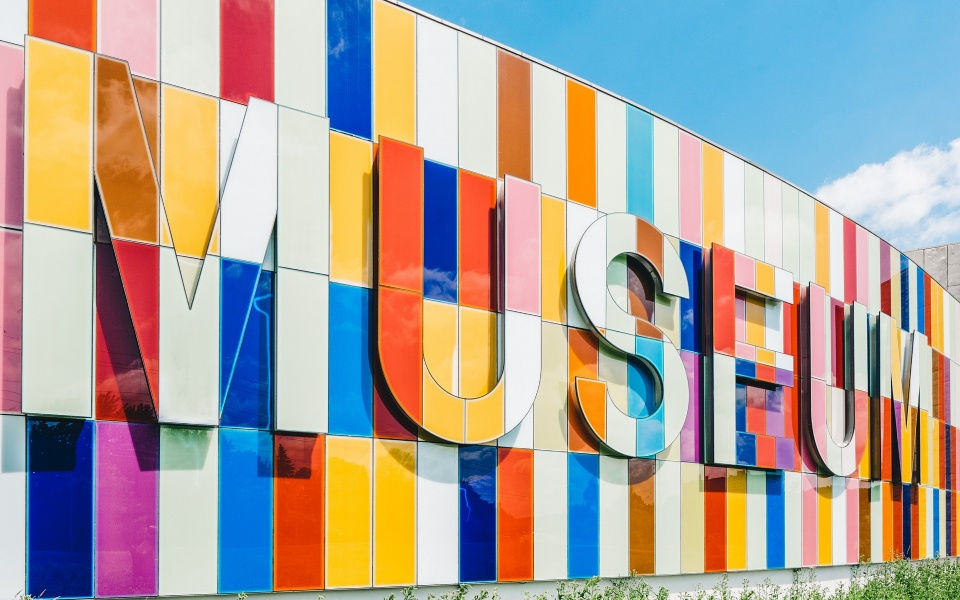 Colorful museum wall with grass and sky